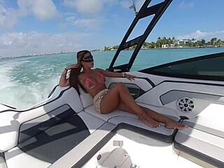 brunette flashes huge tits thong on boat