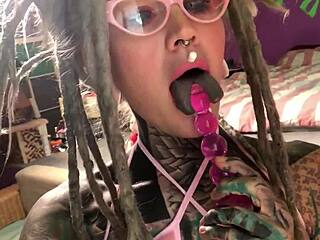 Tattooed glasses cutie in fur lingerie creams on huge dildo