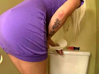 Big boobed blonde Stevie Shae gags monster cock through bathroom gloryhole