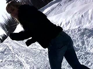 ski trip cutie strips pees in snow outdoors