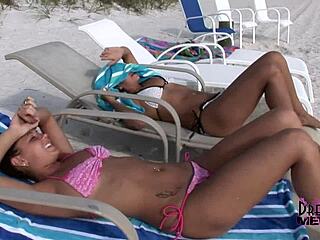 Two wild tanned party girls flash shaved pussies at beach!