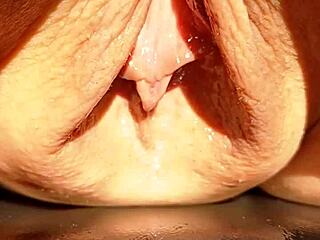 mature beauty flashes her huge soaking wet shaved pussy lips in slow motion tease