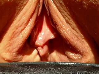 mature beauty flashes her huge soaking wet shaved pussy lips in slow motion tease