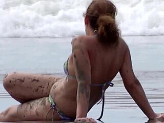 mature woman shows her tits and pussy on the beach to friends