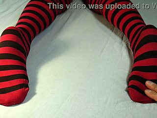 Soles massage and tickling with stripped socks feels intense