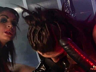 Busty brunette slut teaching chained dude with another chick